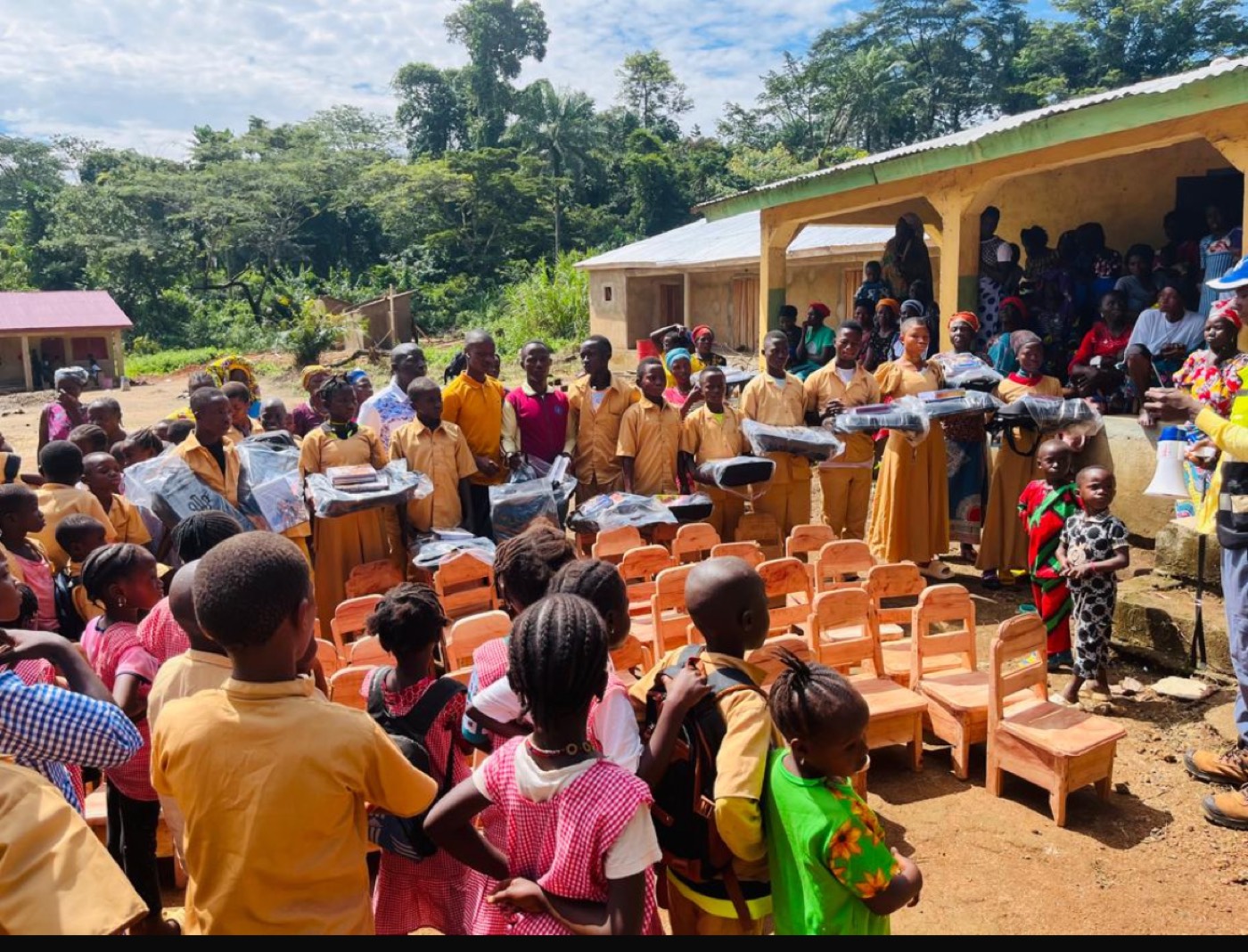 Children gathered at the Millimou school for a distribution of new furniture and resources